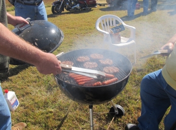 The smell of grilled Burgers 'n Dawgs making everyone hungry.