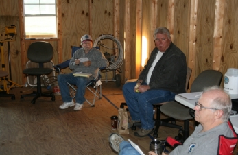 Pres K5DL calls meeting to order  AE5RI enjoys his biscuit WD5BJT opening club mail
